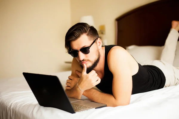 Handsome man with laptop computer