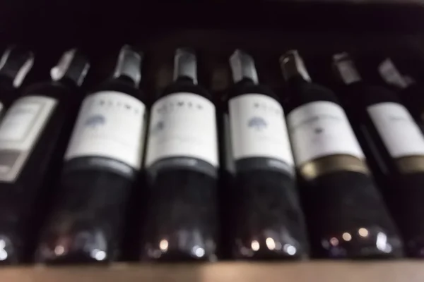 Bottles of wine background.Pictures are blurred