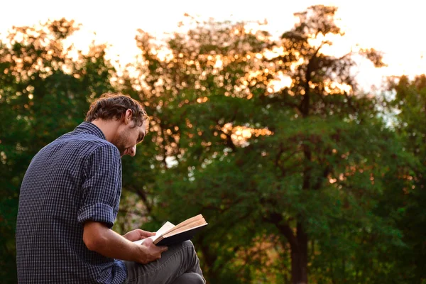 Guy reading book