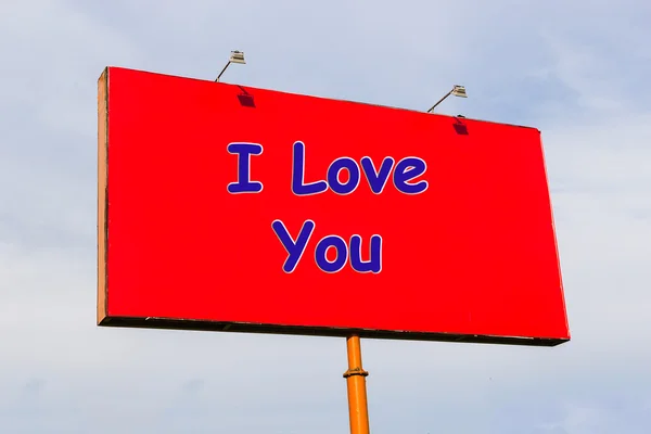 I love you: an inscription on a red billboard on the sky background
