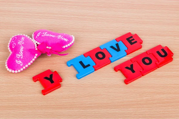 Two pink hearts and the words I love you