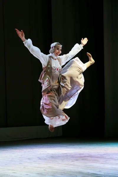 Girl dancing Russian folk dance in the Slavic style