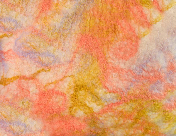 Texture colored felted fabric of dyed sheep's wool and viscose.