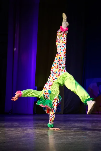 Dancer in a clown costume makes \