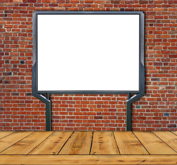 Large blank, empty, white billboard screen  on red brick wall