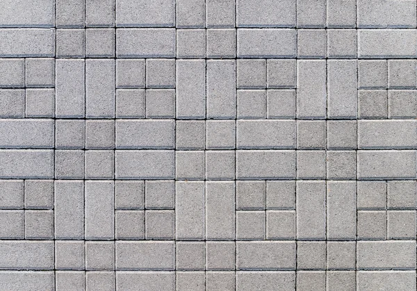 Street covered with gray concrete cubes