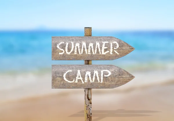 Wooden direction sign with summer camp