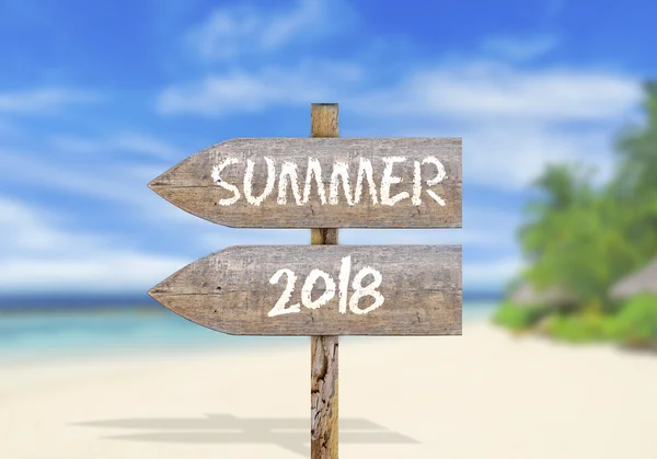 Wooden direction sign with summer 2018