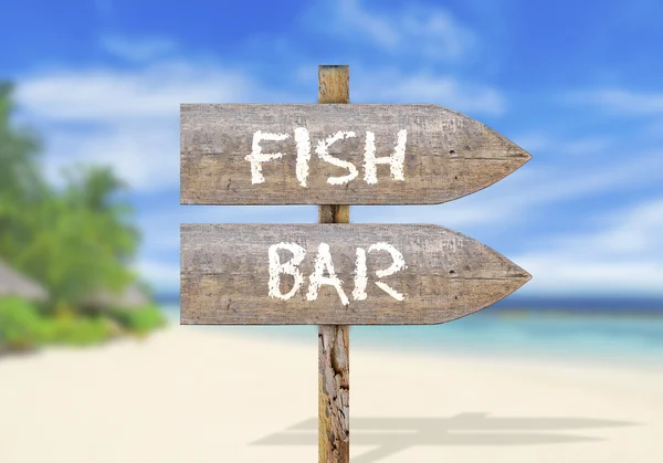 Wooden direction sign with fish bar