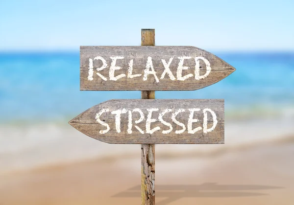 Wooden direction sign with relaxed stressed