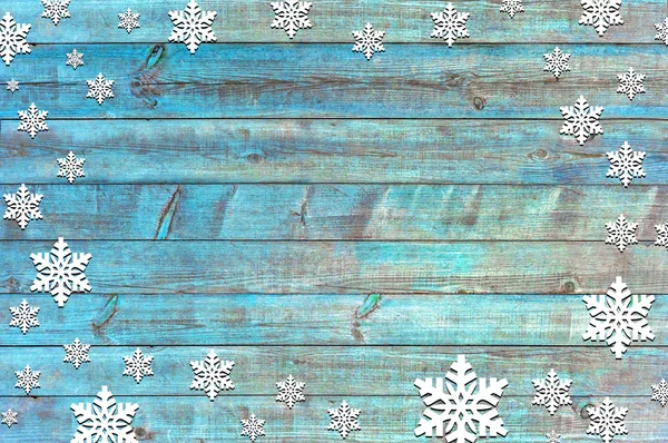 Happy new year background with snowflakes and wooden texture