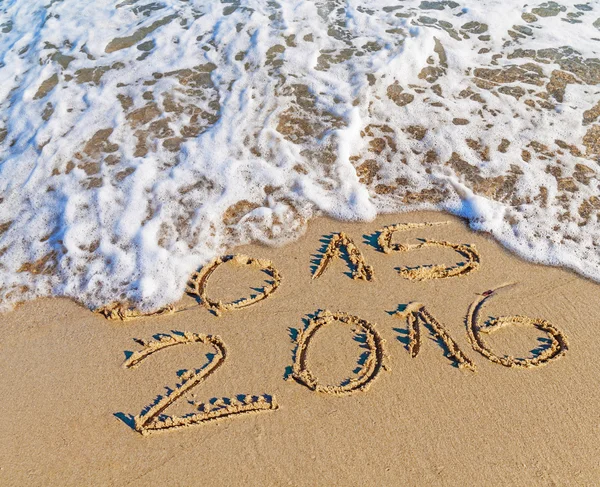 New Year 2016 is coming concept, Happy New Year 2016 replace 2015 concept on the sea beach
