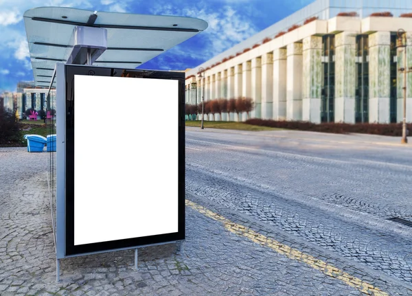 Bus stop on the street with empty billboard