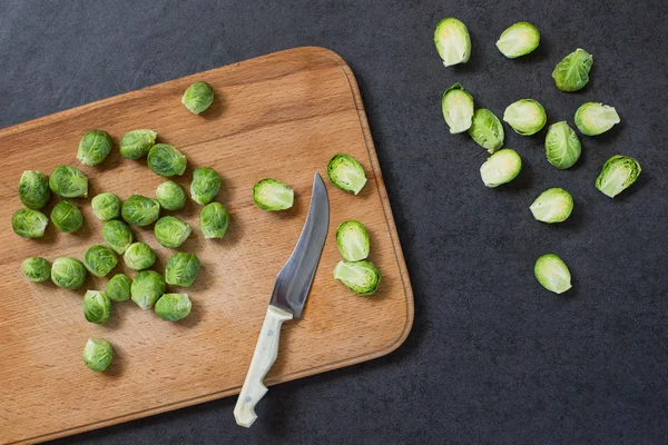 Brussels sprouts on the board with knife