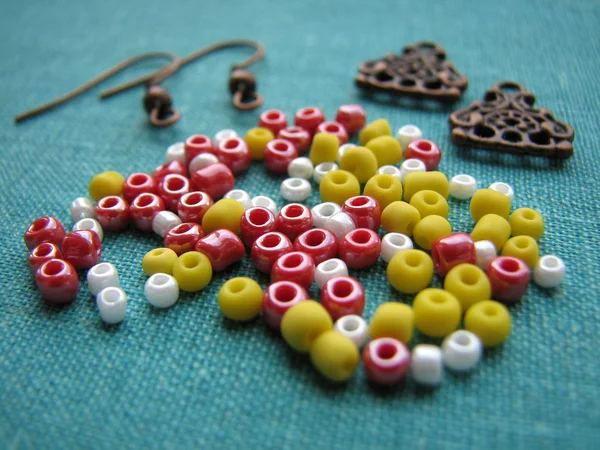 Colorful beads and pieces for making earrings, handmade jewelry