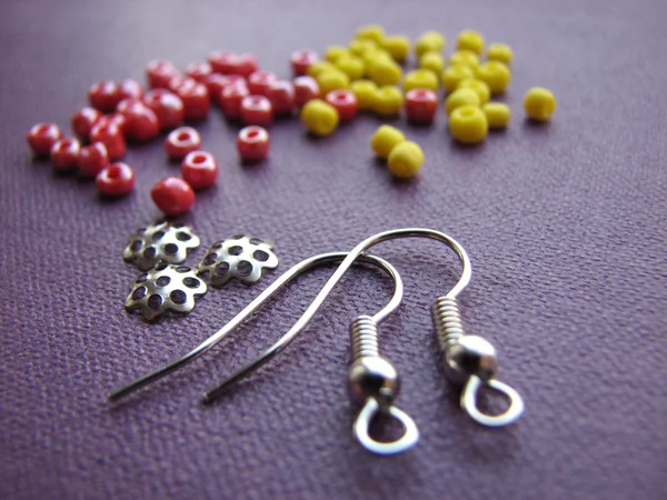 Colorful beads and pieces for making earrings, handmade jewelry