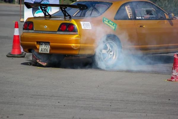 Race car in smoke on track