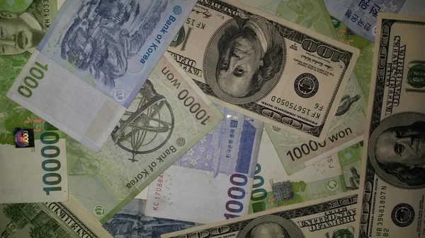 Background Korean currency and US dollars