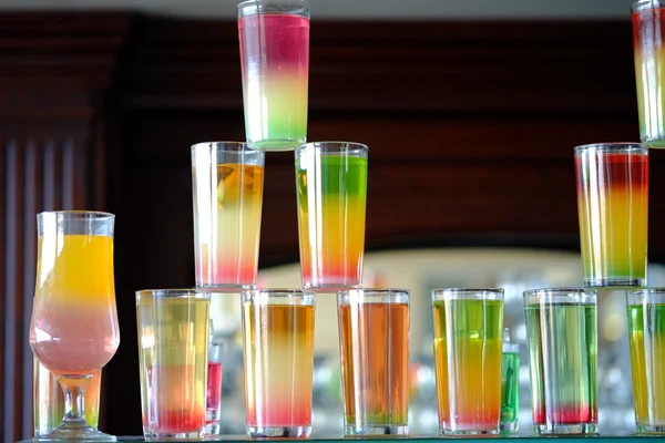 Different colorful alcohol drinks set in bar