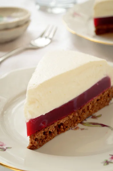 Souffle cake with berry jelly and chocolate biscuit