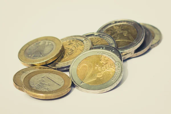 Money - pile of euro coins on white background