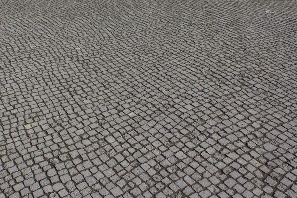 Cobblestone floor, paving stone walkway or street