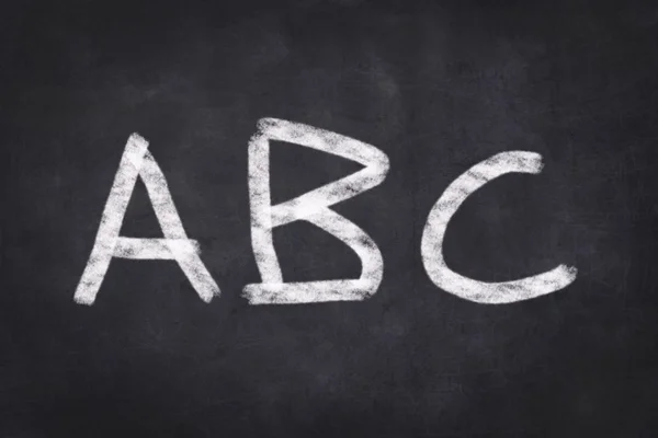 ABC  - text on black chalkboard