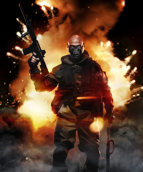 Soldier Man Hold Machine Gun on the Background of the Explosion