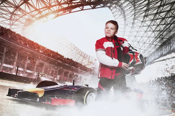 Boy racer with race car at the stadium