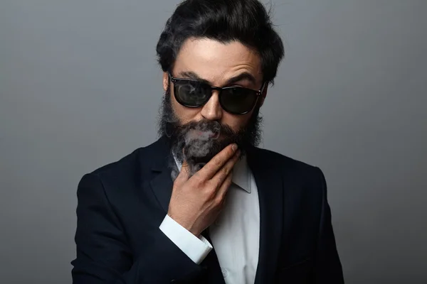 Bearded fashion man in black suit