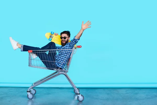 Young man in shopping cart
