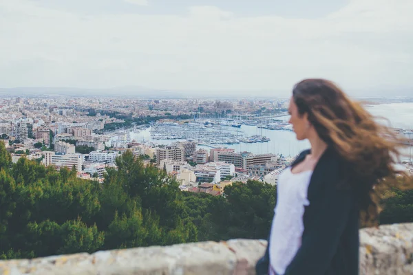 Woman looking down at the City of Palma
