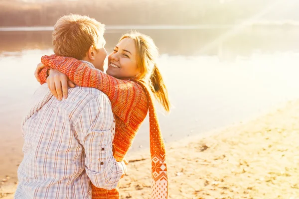 Couple in warm clothes hugging each other