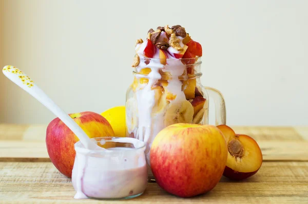 Fresh white yogurt, fruit salad blended with yogurt and flakes