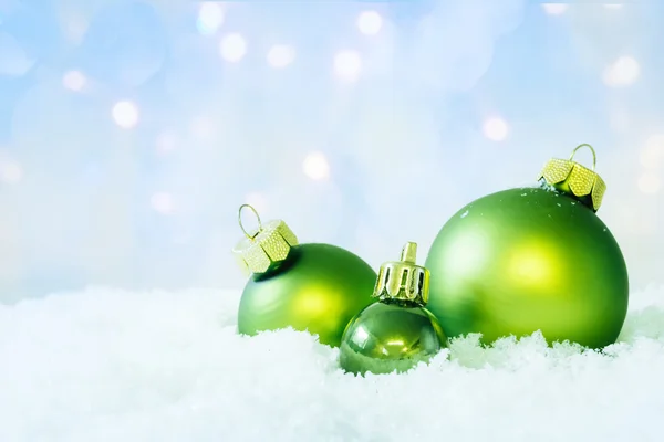 Green Christmas Balls on Snow