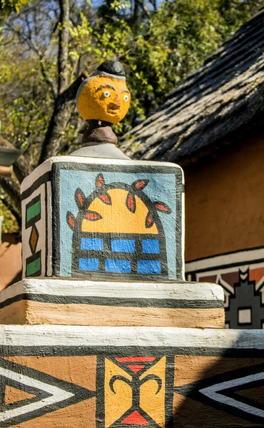 Part of the house in South African village in ethnic Ndebele painting style.