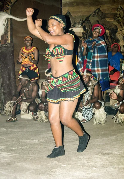 African tribal female ritual dance in traditional handmade costume, bead headdress.