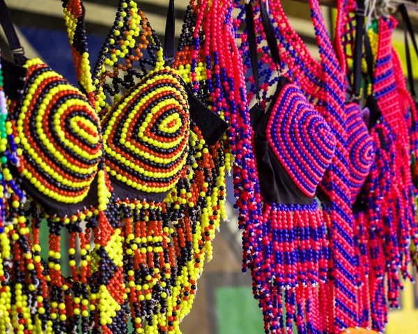 Traditional African colorful handmade beads clothes. Folk art.