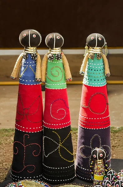 African handmade rag dolls. Colorful beads, fabrics clothes. Local craft market in South Africa. Ethnic costume of tribe Sesotho, Basotho.