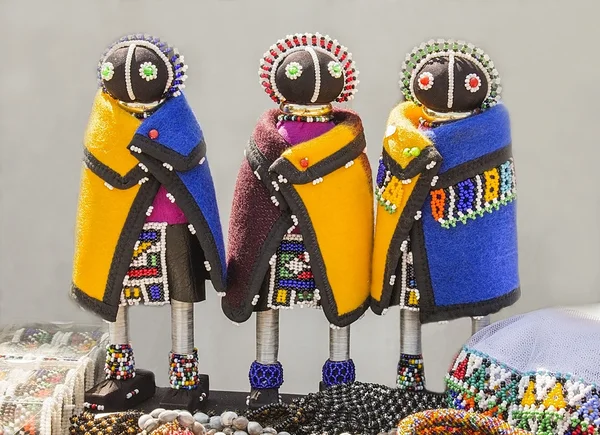 African handmade rag dolls. Colorful beads, fabrics clothes. Local craft market in South Africa. Ethnic costume of tribe Sesotho, Basotho