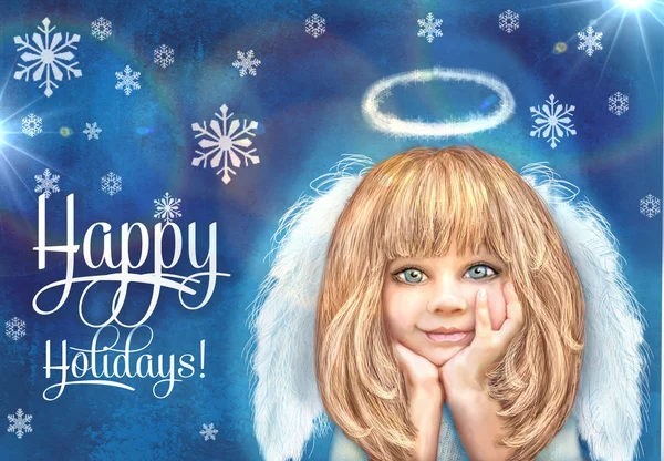 Cute little angel. Happy smiling angel girl with blond hair and white wings isolated on a grunge blue background with snowflake.