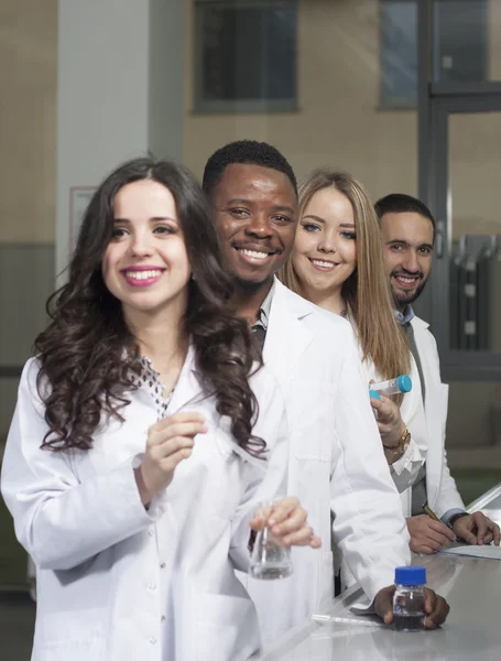 Group of young medical workers are working in lab as lab technic