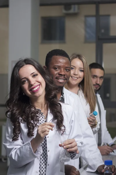 Group of young medical workers are working in lab as lab technic