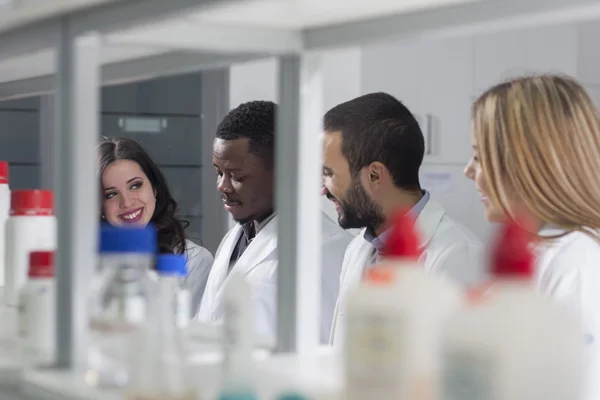 Group of young medical workers are working in lab as lab technic