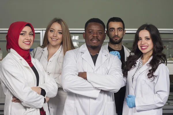 Group of young medical workers are working in lab as lab technic