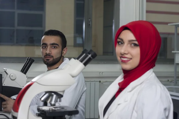 Group of young medical workers are working in lab as lab technician