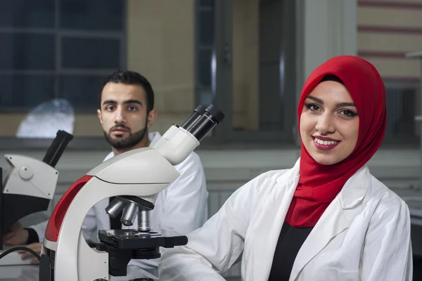 Group of young medical workers are working in lab as lab technician