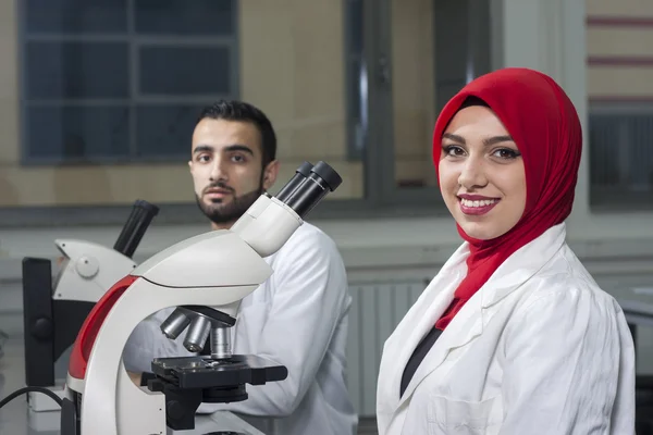 Group of young medical workers are working in lab as lab technic