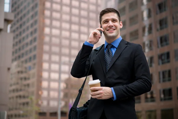 Business man on way to work young executive successful happy smile walking city