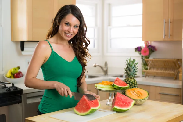 Portrait of a vegan paleo diet vegetarian woman model brunette perfect smile teeth hair skin fruits and vegetables